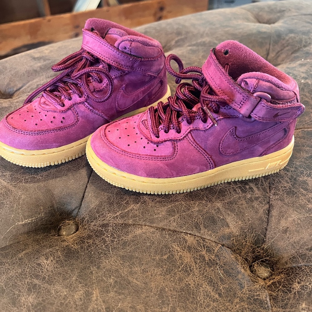 Burgundy suede children’s high top Nikes. Barely worn. Unisex. Size 11c.